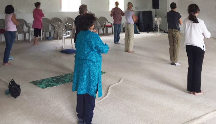 Yoga practitioners doing mountain post